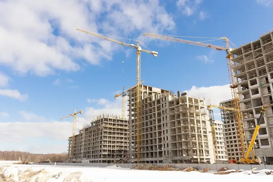 Towers under construction with cranes